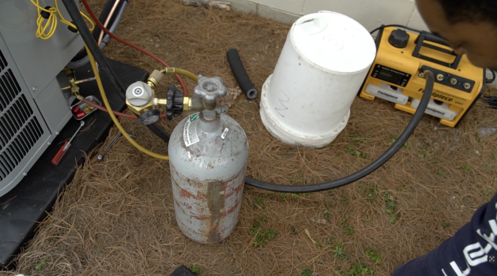 HVAC refrigerant getting refilled.